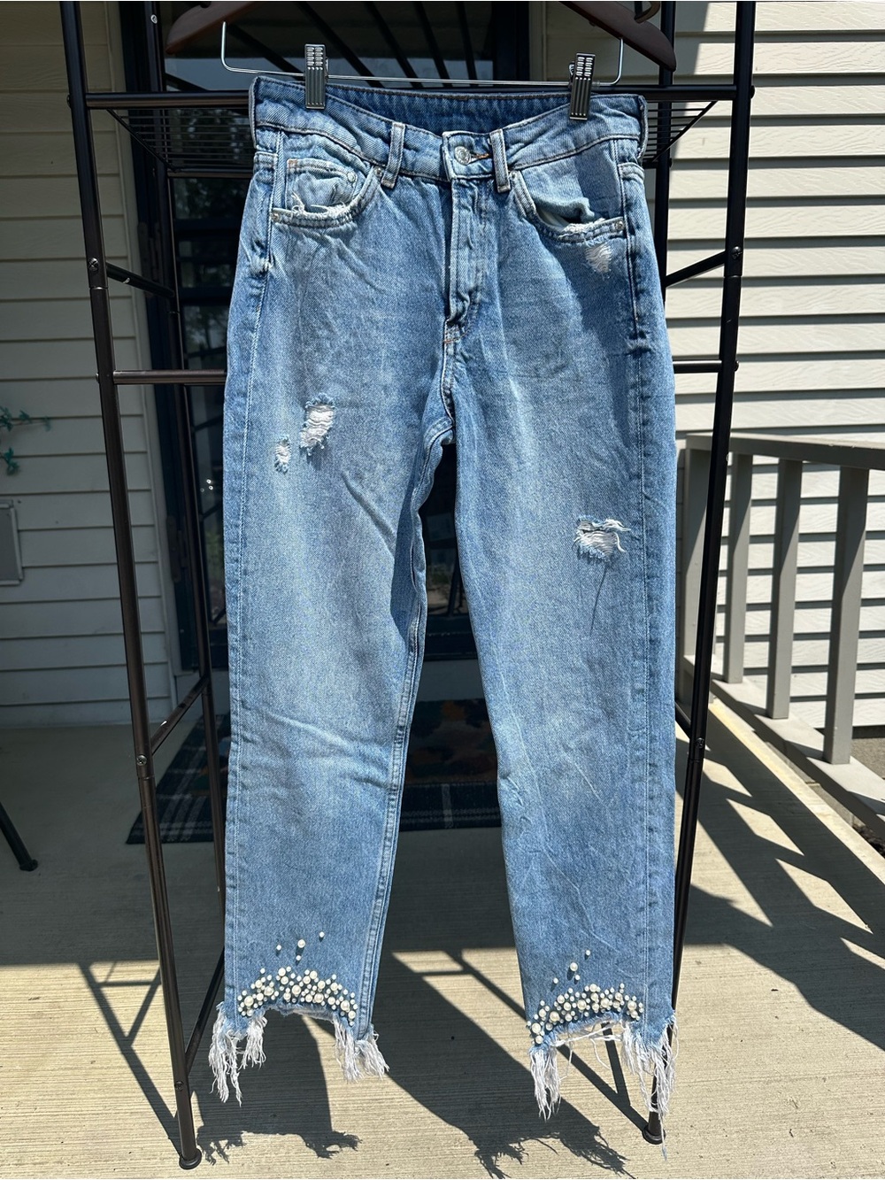 Light Blue Distressed Women's Jeans with Pearl Hem